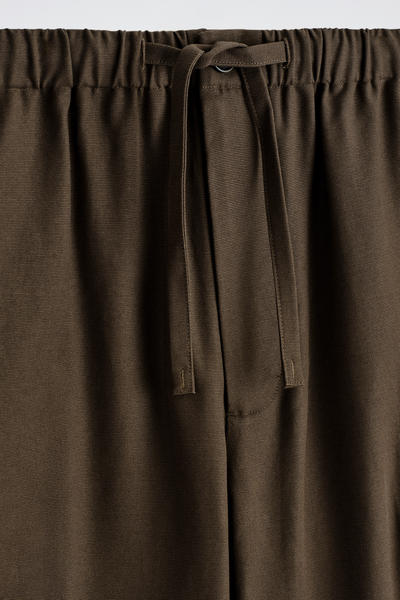 COS ドローストリング付きバレルレッグパンツ