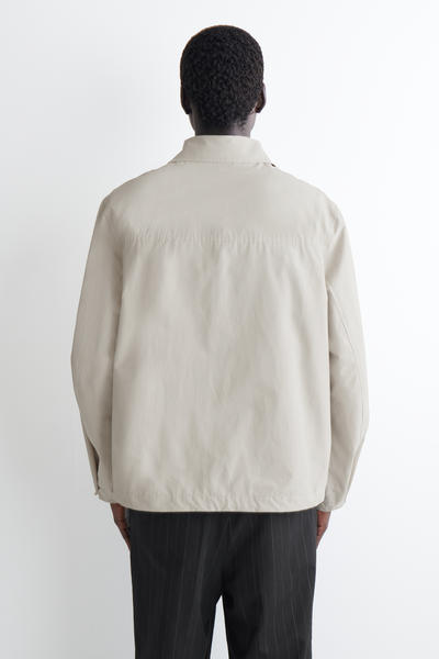 COS テクニカル ウインドブレーカージャケット