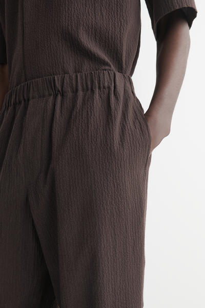 COS シアサッカー テーパードパンツ