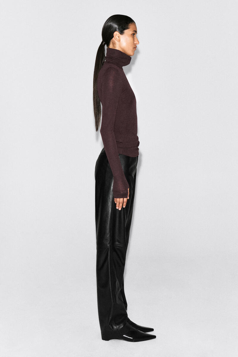 COS メリノウール ボタン付きファネルネックトップ