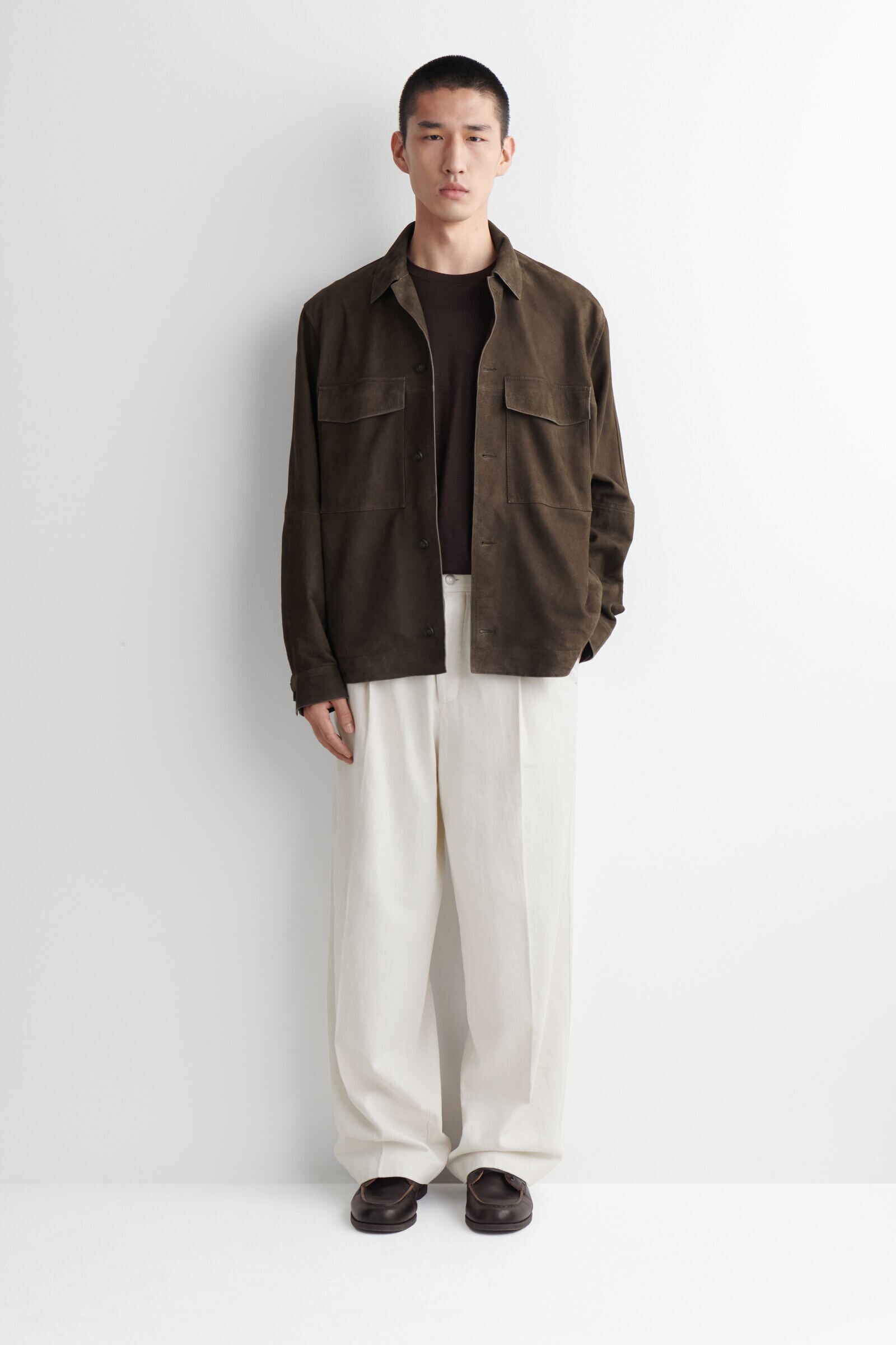 PLEATED RELAXED-FIT WIDE-LEG DENIM TROUSERSWHITE