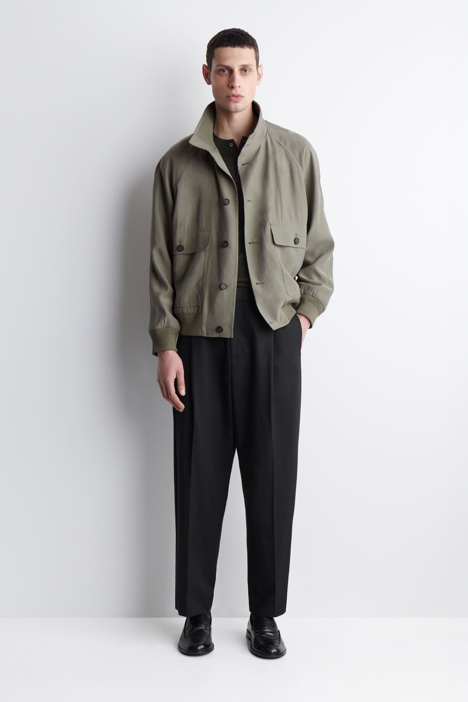 PLEATED RELAXED-FIT TAPERED TROUSERSBLACK