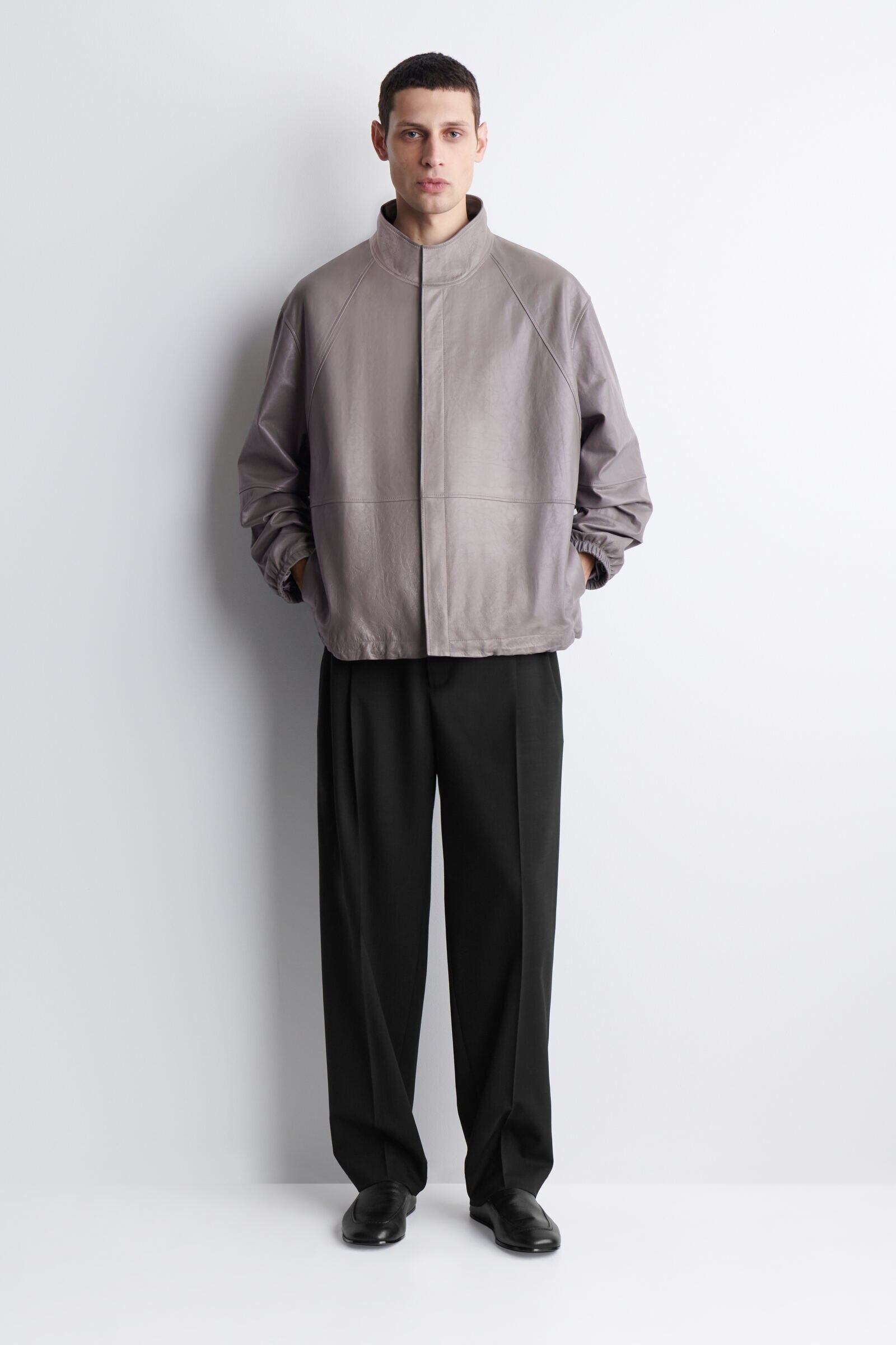 FLUID WOOL RELAXED-FIT WIDE-LEG TROUSERSCARBON