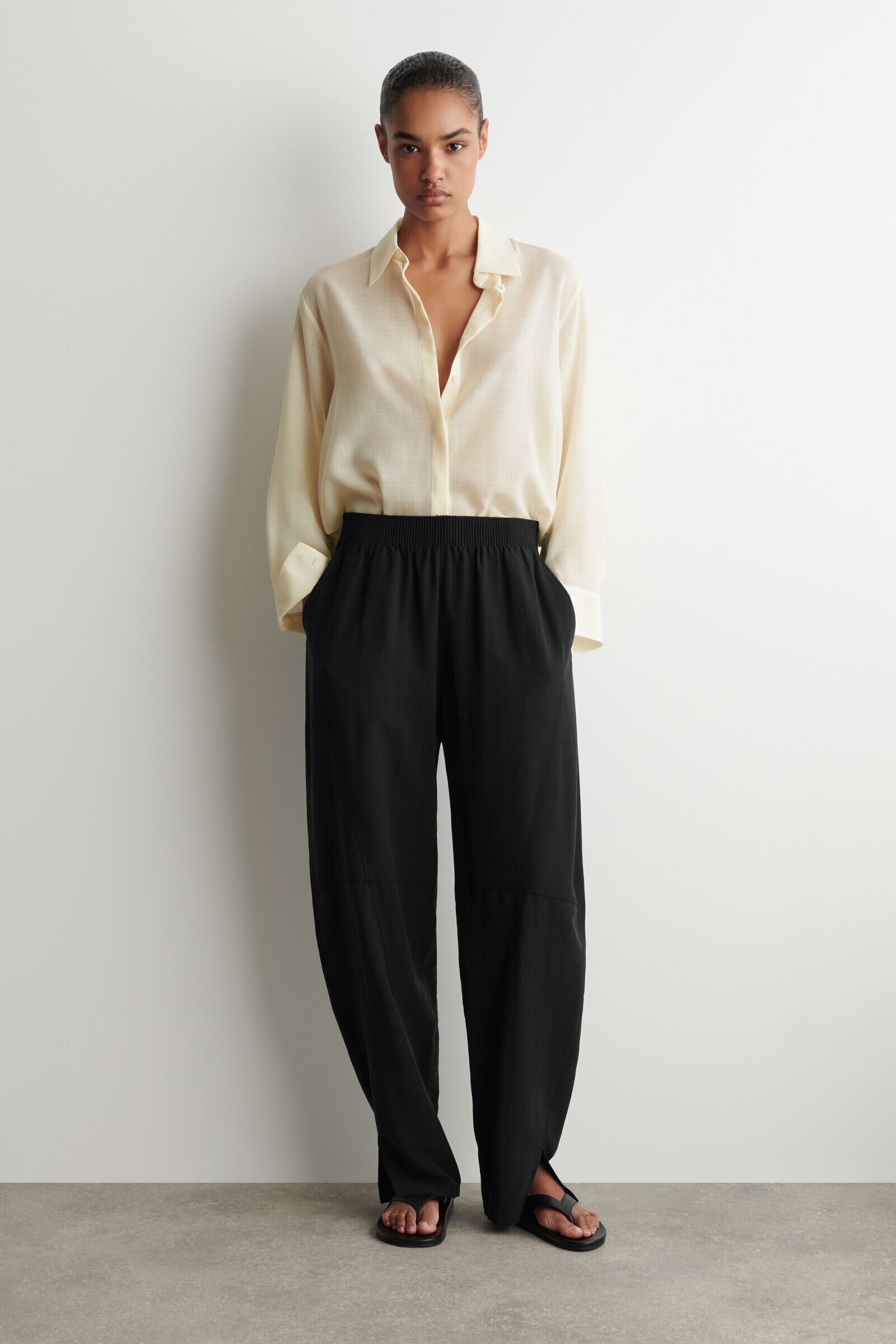 PANELLED ELASTICATED BARREL-LEG TROUSERSBLACK