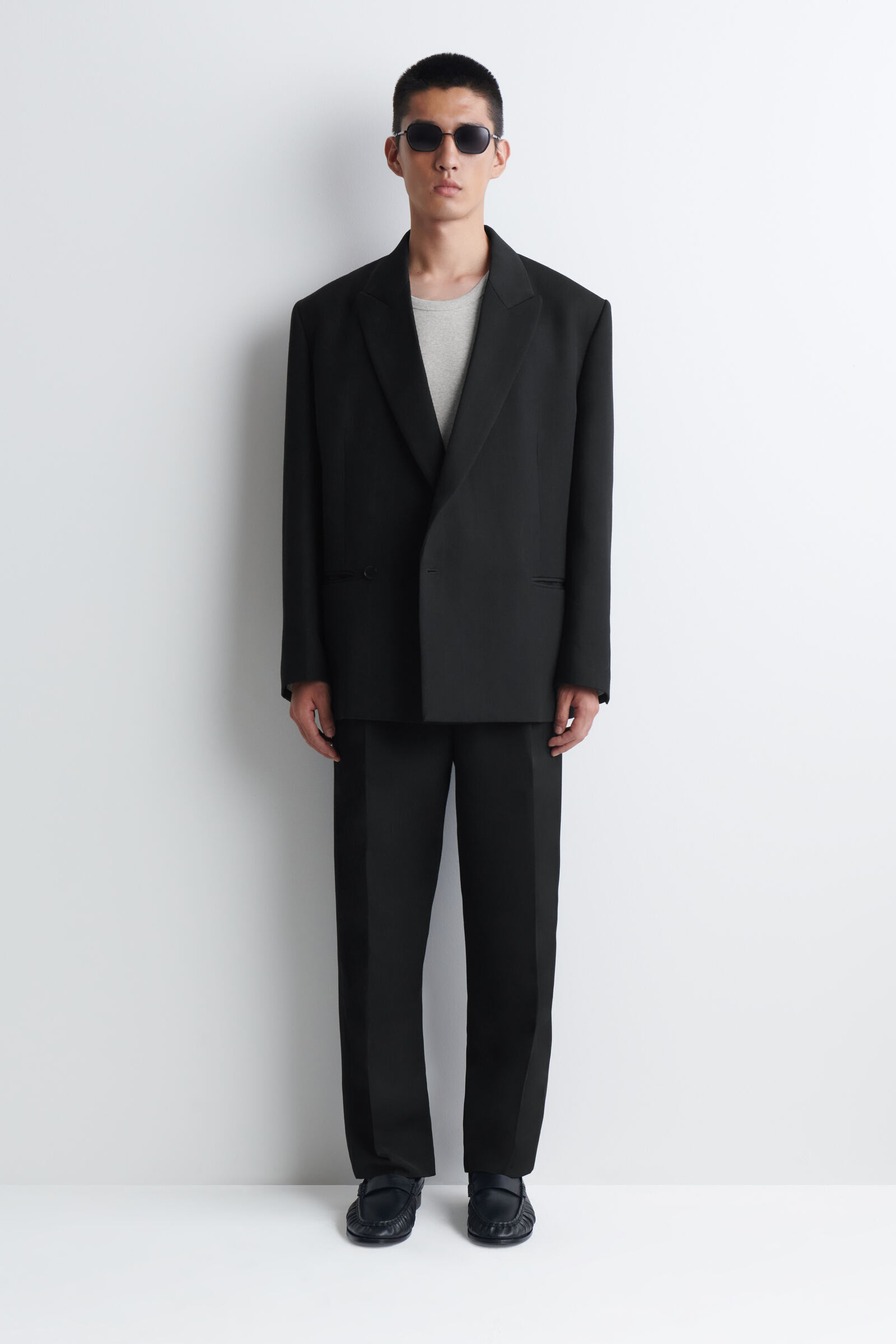 PLEATED WOOL-BLEND RELAXED-FIT TAPERED TROUSERSBLACK